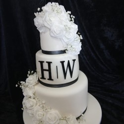 three tier black and white with h and w letters